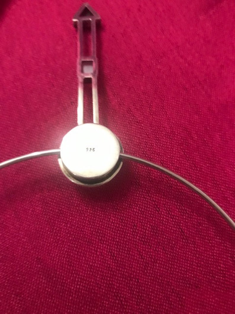 Sterling silver marked 925 Geometric pendant on a silver choker.