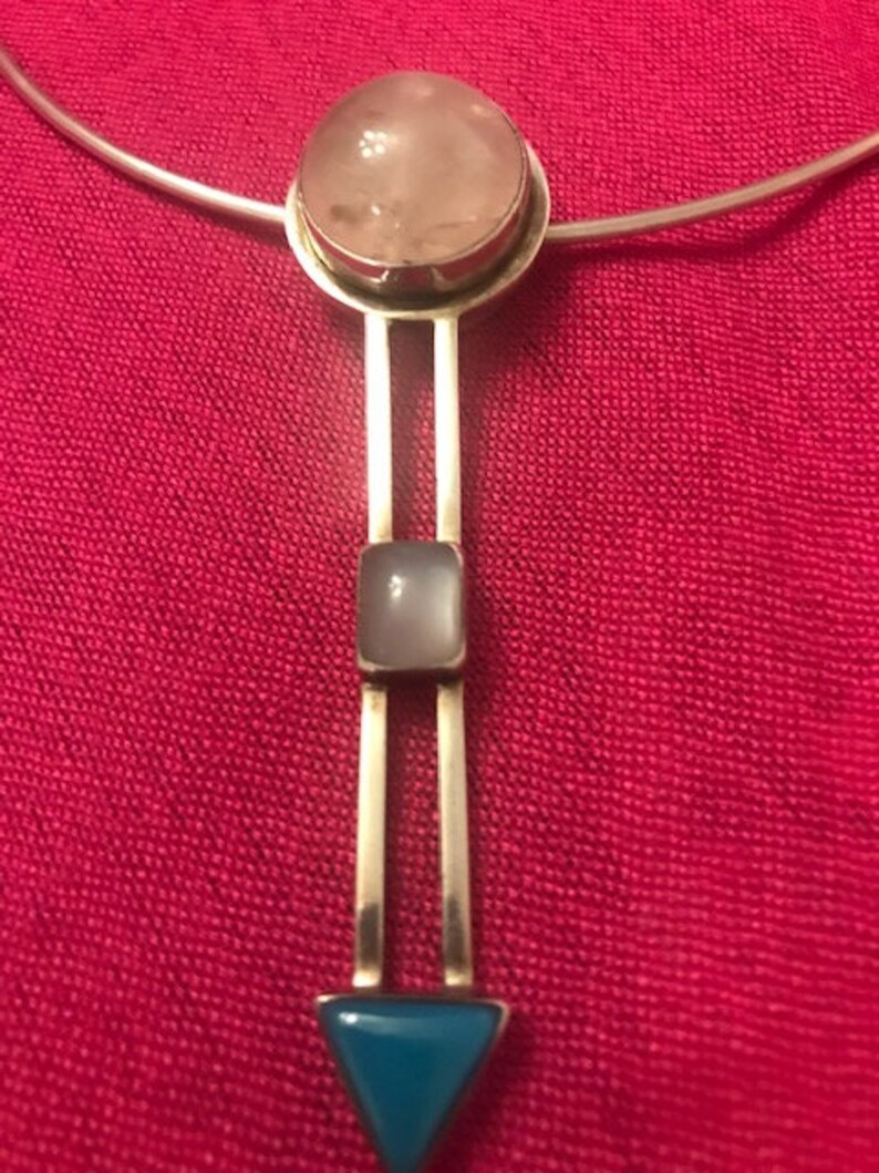 Sterling silver marked 925 Geometric pendant on a silver choker.