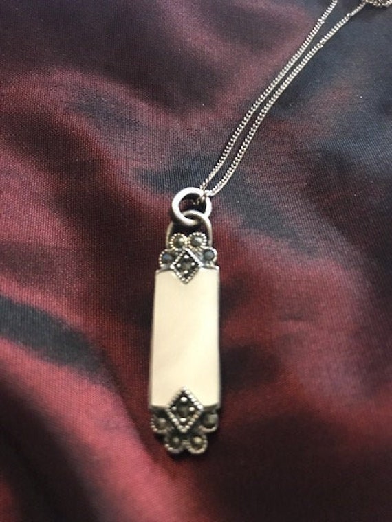 Mother of pearl , marcasite and sterling silver pe