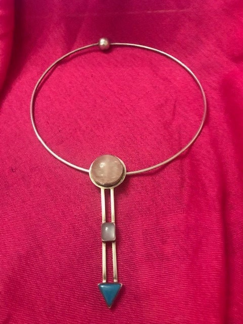 Sterling silver marked 925 Geometric pendant on a silver choker.