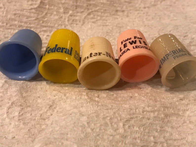 Vintage lot of Advertising Thimbles Plastic