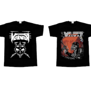 May include: Two black t-shirts with white and red graphic prints. The left shirt has a white graphic of the word "VENOM" with a skull and crossbones design. The right shirt has a red and white graphic of the word "VENOM" with a skull wearing a gas mask and holding a rifle. The text "CAT AND THE" is printed below the word "VENOM".