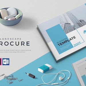 May include: A white brochure mockup with a blue accent and the text "Business Template 2017". The brochure is lying on a light blue surface with a white background.