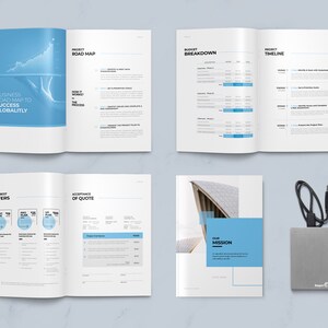 May include: A brochure with a blue and white color scheme. The brochure is open to show the different sections, including a business road map, budget breakdown, project timeline, our best offers, acceptance of quote, and our mission. The brochure is on a white surface with a silver external hard drive and a black cable.