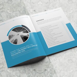 May include: An open book with a blue background and a black and white photo of a city skyline with airplanes flying overhead. The text "CHASE THE VISION. NOT THE MONEY. THE MONEY WILL END UP FOLLOWING YOU." is printed on the left page. The right page has the word "CONTENTS" printed at the top and a list of items with page numbers.