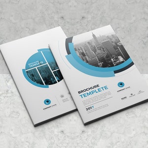 May include: A white and blue brochure template with a cityscape photo and the text "Brochure Template 2017".