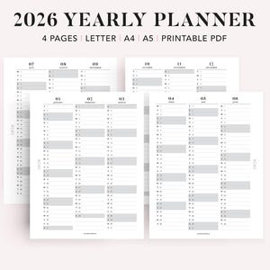 Puede incluir: Un planificador anual para 2026, con un diseño minimalista. Las páginas blancas presentan acentos grises, mostrando los meses y días en un formato claro. El texto superior dice "2026 YEARLY PLANNER".