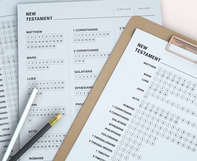 May include: A white sheet of paper with a checklist for reading the New Testament. The checklist includes the books of the New Testament, with spaces to mark off each chapter as it is read. The paper is on a brown clipboard with a gold clip.