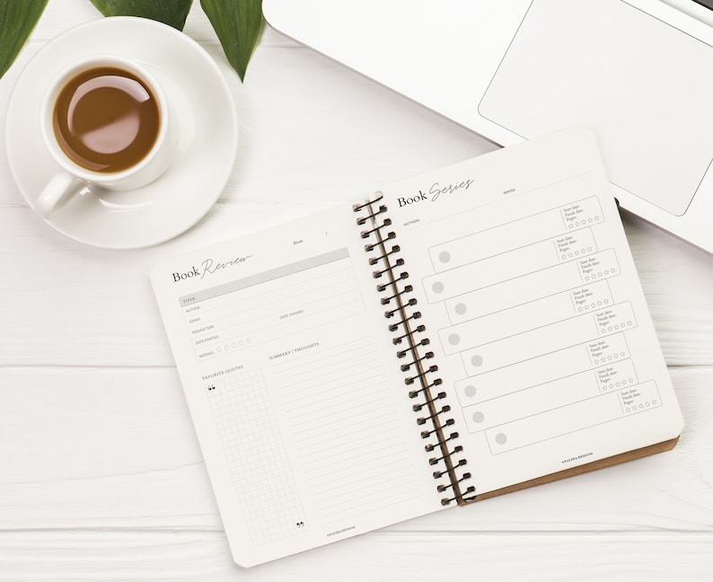 May include: A white notebook with a brown cover and a spiral binding. The notebook is open to two pages, one labeled "Book Review" and the other labeled "Book Series". The pages are filled with blank lines and circles for rating books.