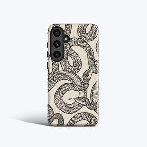 May include: A phone case with a repeating pattern of black snakes on a cream background. The snakes are intricately drawn with detailed scales and coiled bodies, creating a striking contrast against the light backdrop. The case has a camera cutout.