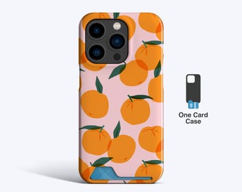 May include: A phone case with a pink background and a pattern of orange citrus fruits with green leaves. The case has a built-in card holder and the text "One Card Case".