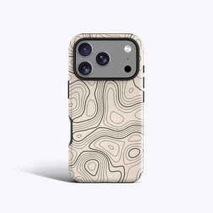 May include: A phone case featuring a beige background with a black topographic map line pattern. The case has a rectangular camera cutout at the top with a dark gray border, housing three circular camera lenses and a small circular flash.