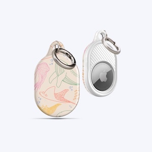 May include: Two AirTag holders. One features a cream background with colorful sea creatures, including a jellyfish, whale, and stingray. The other is white with a silver ring and a textured back.