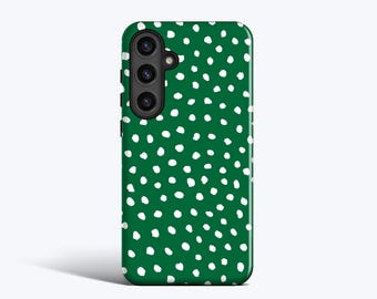 May include: A green smartphone case with a white polka dot pattern. The case has a camera module with three lenses and a flash. The design is a repeating pattern of irregular white dots on a solid green background.