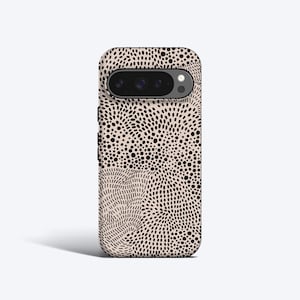 May include: A black and white phone case with a swirling pattern of dots and lines. The case has a cutout for the camera lens.