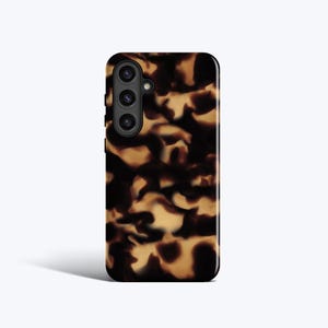 May include: A black smartphone case with a tortoiseshell pattern. The case has a glossy finish and a camera module with three lenses. The tortoiseshell design features shades of brown and tan, creating a classic and stylish look.