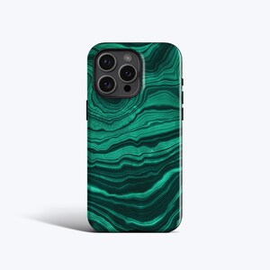 May include: A smartphone case featuring a vibrant green and dark forest green malachite stone pattern with swirling, organic banded textures. The case has a precise cutout for the triple-lens camera system on the upper left corner of the device.