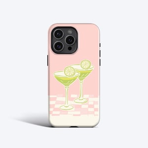 May include: Pink iPhone case with a design of two green cocktails with lime wedges on a pink and white checkered background.