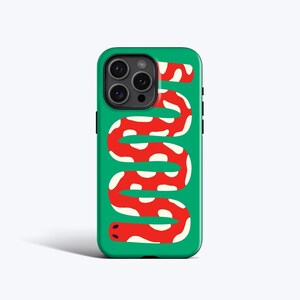 May include: A green smartphone case featuring a graphic of a long, winding red snake with white spots. The snake pattern covers the back of the case, which has a cutout for a triple-lens camera system in the upper left corner and black buttons.