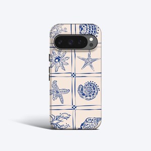 May include: A phone case with a light beige background featuring a grid pattern in blue. Each square contains a detailed blue line drawing of marine life, including various seashells, a starfish, and a crab, arranged in a repeating layout.