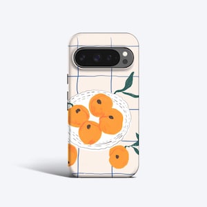 May include: A phone case with a playful design of peaches on a plate. The case has a cream background with a blue grid pattern and green leaf details. The peaches are depicted in a bright orange hue.
