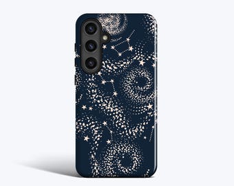 May include: A navy blue phone case featuring a celestial design. The case has a pattern of white dots and stars, creating a galaxy-like effect. The phone case has a camera module on the upper left side.