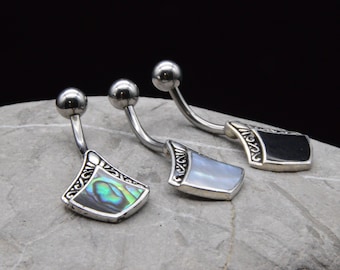 May include: Three silver belly button rings with different colored abalone shell accents. The rings are curved and have a decorative border.