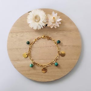 African turquoise and gold-plated stainless steel charm bracelet