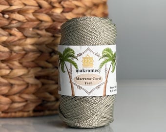 May include: A spool of sage green macrame cord yarn, labeled "makromeci" and "Macrame Cord Yarn".