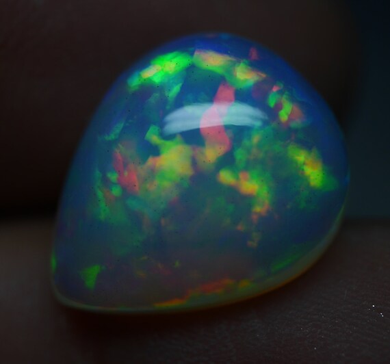 Natural Ethiopian Opal Pear shape ring sized nice fire