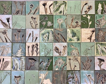 May include: A collection of 36 square ceramic tiles with a green and brown glaze. Each tile features a unique pressed botanical design of various plants and flowers.