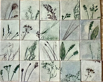 May include: A collection of twenty-five square ceramic tiles, each featuring a unique botanical design. The tiles showcase various green and brown plant illustrations against a crackled, off-white background. The arrangement creates a cohesive, nature-inspired aesthetic.