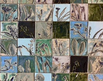 May include: A collection of 36 square tiles with a variety of botanical designs in shades of green, blue, and brown. Each tile features a unique arrangement of leaves, stems, and flowers.