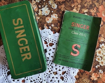 Vintage singer sewing machine tin with spare parts and instruction manual for Class 215G
