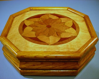 Carved music box with original designed handmade wood inlay       Artisan made in Virginia.