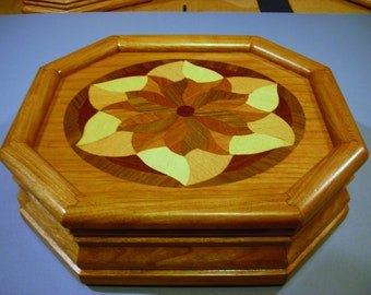 Carved music box with original designed handmade wood inlay       Artisan made in Virginia.