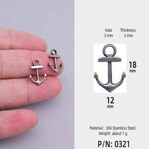 May include: Silver anchor charm with a 3 mm hole. The charm is 12 mm wide and 18 mm tall. The charm is made of 304 stainless steel and weighs about 1 gram. P/N: 0321