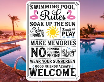 May include: A white sign with black text and pink flamingo illustrations. The sign reads "Swimming Pool Rules: Soak Up The Sun, Relax and Unwind, Laugh and Play, Make Memories, No Running, Pushing, Peeing, Wear Your Sunscreen, Good Friends Always, Welcome".