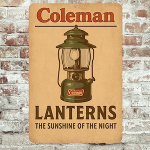 May include: A vintage metal sign depicting a green Coleman lantern. The sign features the word "Coleman" in red, with "Lanterns" and "The Sunshine of the Night" in brown. The background is a tan colour, evoking a retro aesthetic.