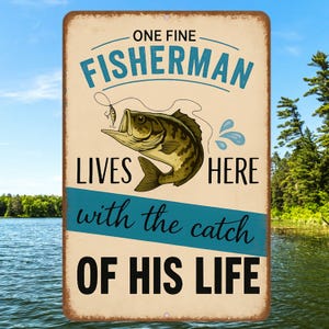 Funny Fisherman Sign – “One Fine Fisherman Lives Here” 8x12 Vintage Metal Sign for Lake House, Cabin or Fishing Gift