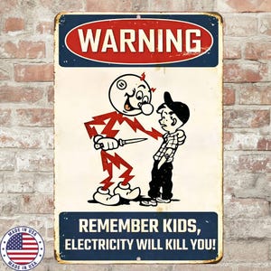 May include: Aged metal sign with a cartoon illustration of a lightning bolt character holding a knife, confronting a boy. The sign reads "WARNING" at the top and "REMEMBER KIDS, ELECTRICITY WILL KILL YOU!" at the bottom. Includes a "MADE IN USA" emblem. The sign has a distressed finish.