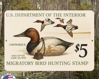 May include: A vintage U.S. Department of the Interior sign featuring a Canvasback duck illustration. The sign includes the text "Migratory Bird Hunting Stamp" and the price of $5. The sign is cream-colored with a circular "Made in USA" sticker.