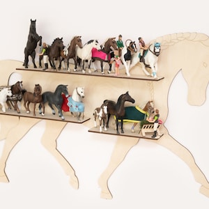 May include: Wooden horse-shaped shelf with two shelves, displaying a collection of miniature horse figurines and riders. The figurines are in various poses and colors, including brown, black, white, and gray.