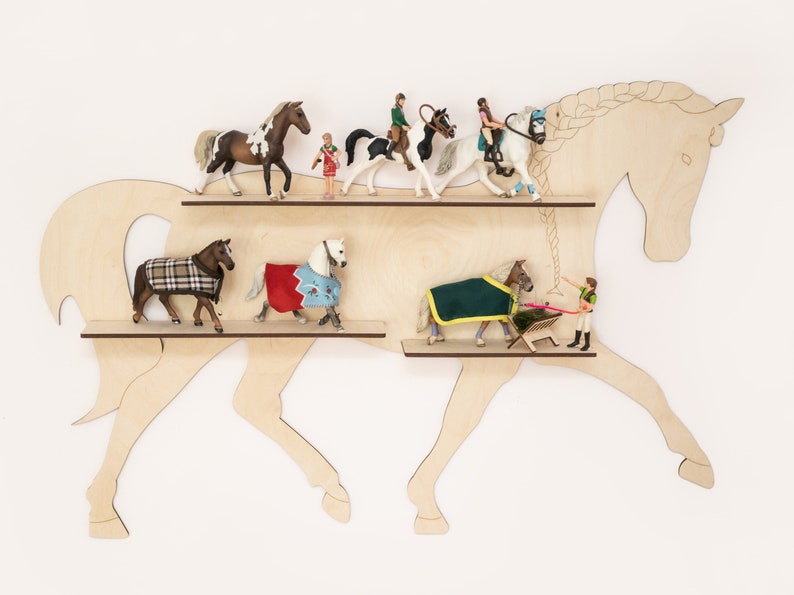 May include: Wooden horse-shaped shelf with two shelves. The shelves are filled with miniature horse figurines and riders.