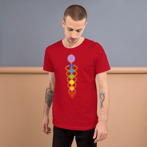May include: A red t-shirt with a graphic of the seven chakras, a spiritual concept in Hinduism and Buddhism, represented by colorful circles connected by lines.