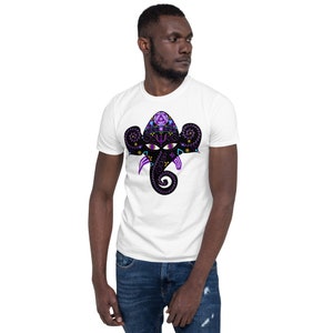 May include: A white t-shirt featuring a black and purple graphic of a detailed Ganesha head with a third eye.