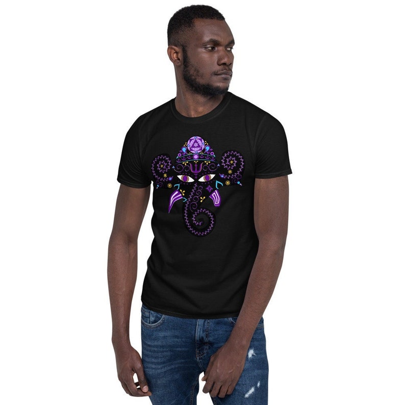 May include: A black t-shirt featuring a purple and gold graphic of a stylised elephant head with intricate details.