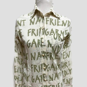 1990&#39;s Moschino Cheap and Chic Nature Friendly Garment blouse with printed words USA size 4 White and moss green lettering