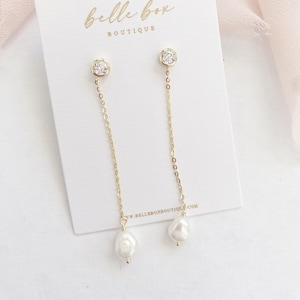 Pearl and diamante drop earrings top