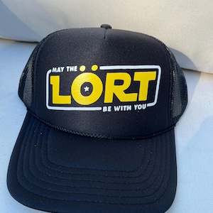 May include: Black trucker hat with a yellow and white logo that says "May the Lort be with you".